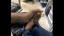 White guy strokes his dick while at work